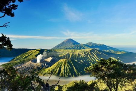 Tengger Caldera, filled with more than a dozen of mountain. The most notable one here is Mount Bromo with its smoking crater, Mount Batok in the foreground, and Mount Semeru in the far back, which is also the highest mountain in Java.