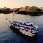 Traditional phinisi liveaboard boat sailing in Komodo National Park